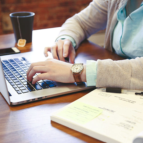 Tutor helping with a tablet