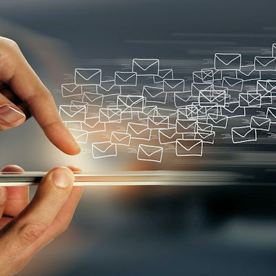 Email and messaging icons on a phone screen